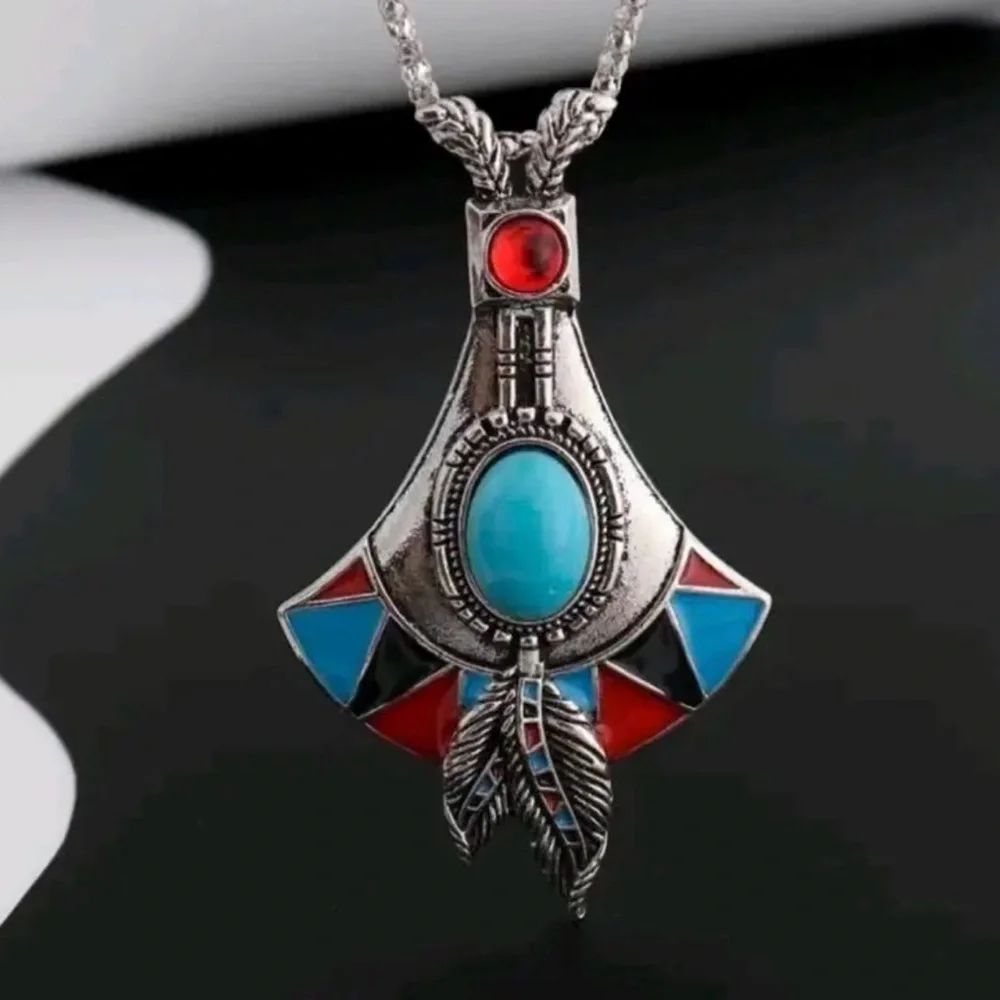 Bohemian Silver Pendant Necklace with Turquoise and Red Accents.